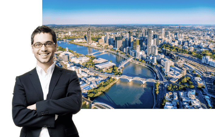Conveyancing lowyers Brisbane - happy conveyancing solicitor standing behind an image of Brisbane QLD